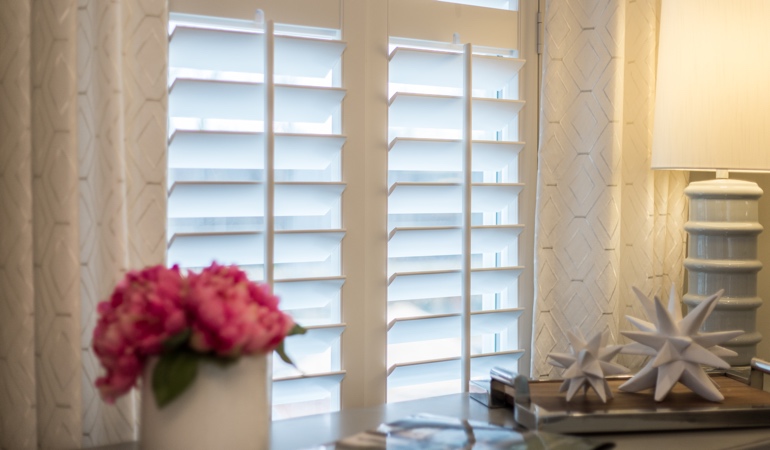 Plantation shutters by flowers in Sacramento